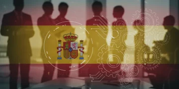 Profesionales colaborando en un entorno moderno, con elementos gráficos de innovación y la bandera de España, representando las ayudas estatales a la innovación en 2026.